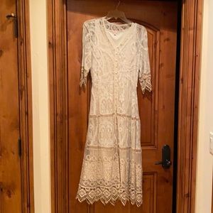 Sweet lace dress with slight elastic gather at waist.
